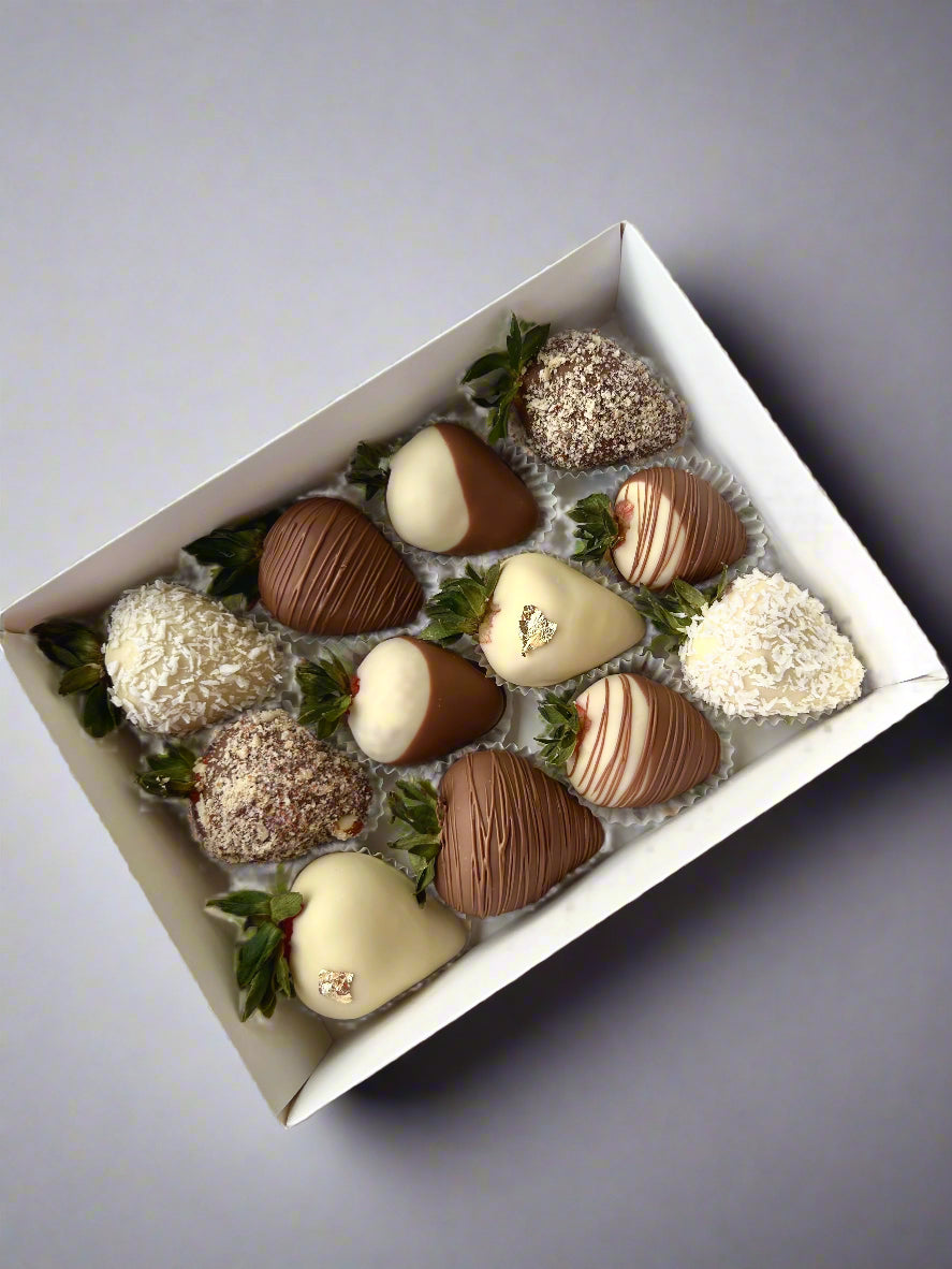 Chocolate dipped strawberries in a box on the grey background