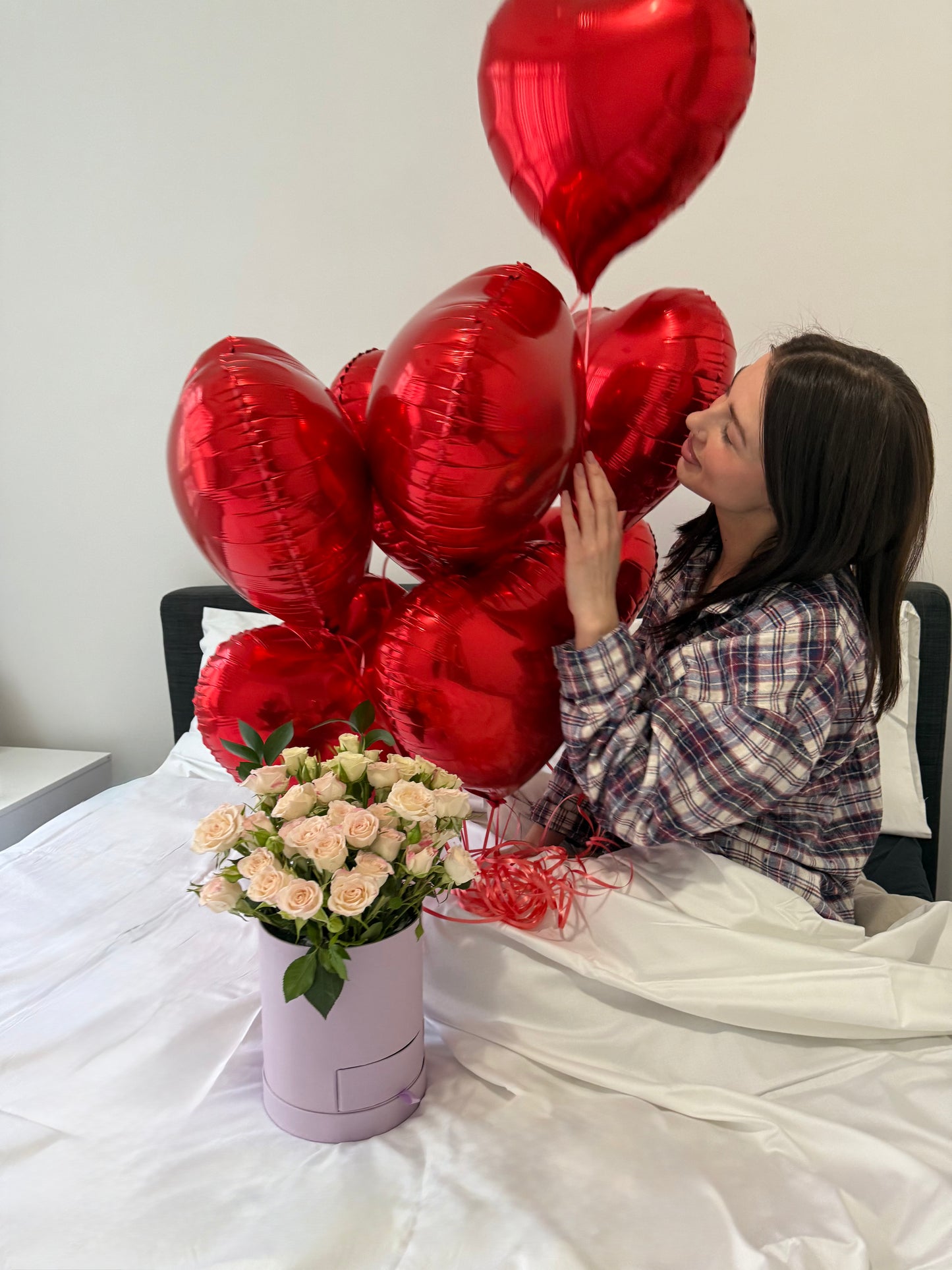 foil helium balloons with model and box with flowers