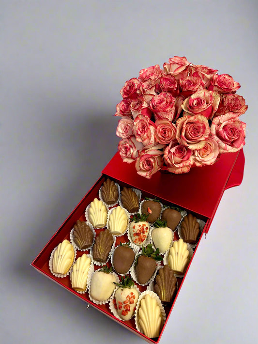 box with roses and chocolate dipped strawberries and Madeleines